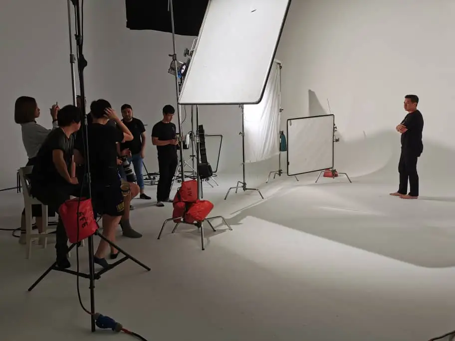 Behind the scenes on a white cyclorama commercial set